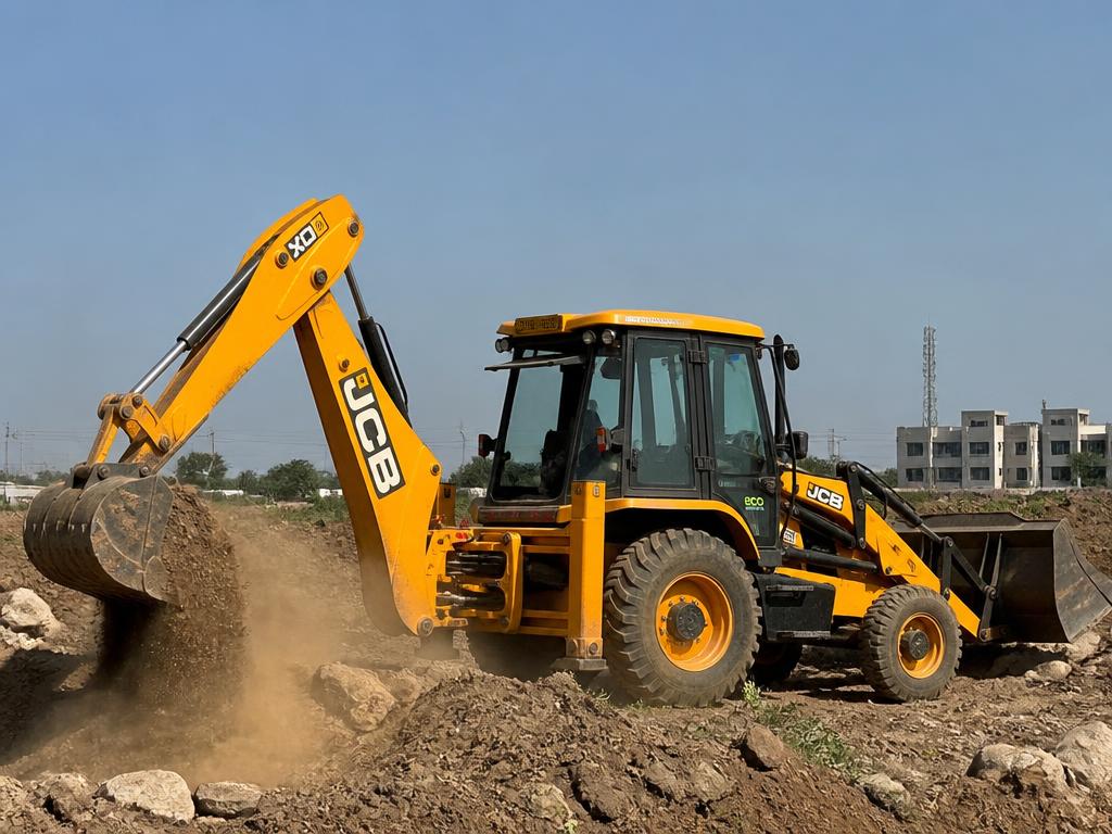 Yellow JCB backhoe excavator digging at a construction site